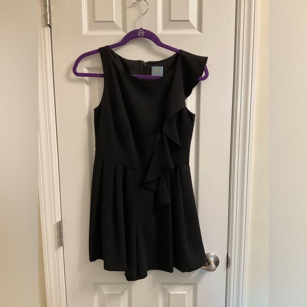 Black romper with ruffle detail size o